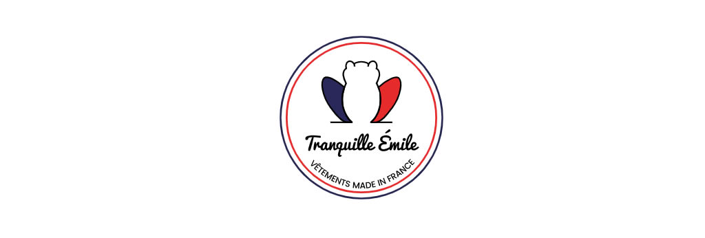 Logo de la marque française Tranquille Émile avec un emblème circulaire aux couleurs bleu, blanc et rouge et la mention « Vêtements Made in France ».