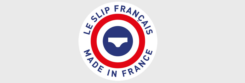 Logo de la marque Le Slip Français avec un emblème circulaire bleu, blanc et rouge et la mention « Le Slip Français – Made in France ».
