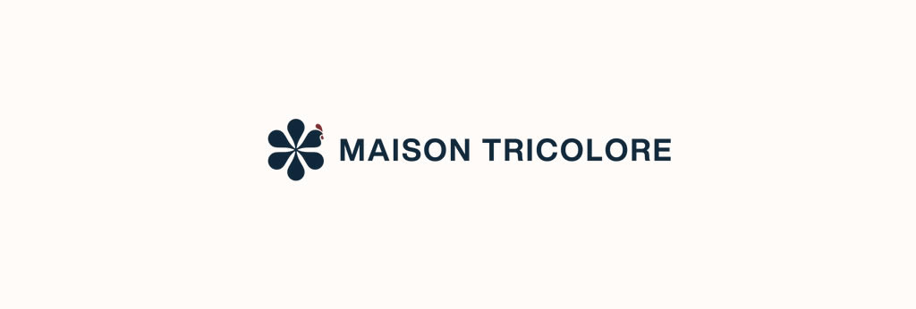 Logo de la marque française Maison Tricolore avec un emblème en forme de fleur stylisée et le nom « Maison Tricolore » sur fond clair.